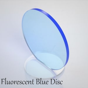 May include: A fluorescent blue disc with a blue rim. The disc is on a clear stand.