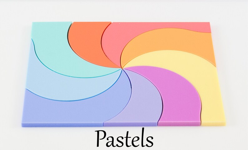 May include: A pastel-colored puzzle with a spiral design. The puzzle is made up of 8 pieces, each a different shade of pastel. The puzzle is labeled "Pastels".