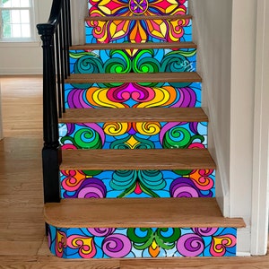 May include: A set of colorful, patterned stair treads with a psychedelic design. The treads feature a variety of colors, including blue, green, yellow, orange, pink, and purple. The design is intricate and detailed, with swirls, flowers, and other abstract shapes.