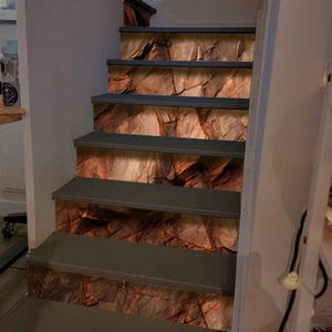 Dark red orange brown rock texture with cracks Stair Panel Rough mountain surface Stone granite background stair risers Brown rock staircase