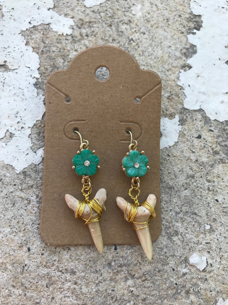 Wrapped fossilized shark teeth and flower shell earrings in gold tone