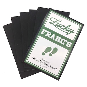 May include: Five black non-slip shoe treads with the text "Lucky Franc's Non-Slip Shoe Tread 5 pieces 3in x 5in" printed on a white background with green lettering.