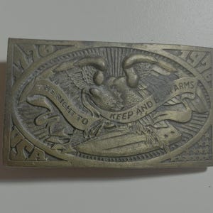 Vintage belt buckle featuring the phrase &quot;The Right to Keep and Bear Arms.&quot;