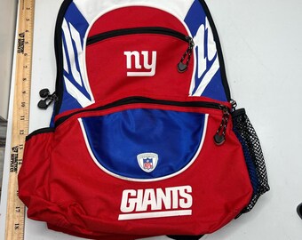Mochila unisex de los New York Giants de la NFL con estampado de bloques de color y diseño de fútbol americano.