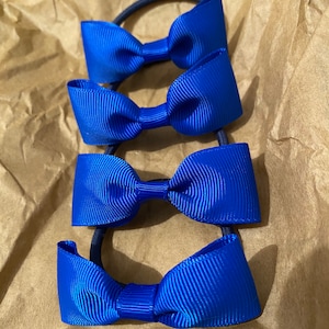 4 royal blue school bows on elastic ties. School hair accessories. School hair ties. Other School colours available