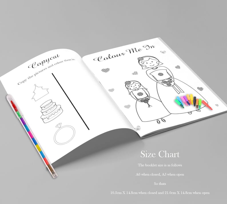May include: An open coloring book with the text "Copycat" and "Colour Me In". The pages feature line drawings of a cake, ring, and two figures in dresses. A multi-colored pen rests on the left side. The size chart is also visible.