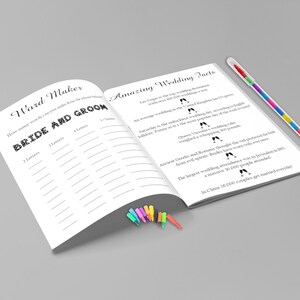 May include: A white open book with the text "Ward Maker" and "Amazing Wedding Facts". The book has lined pages and is accompanied by a colorful pen and a set of small, colorful markers. The text includes wedding-related facts.