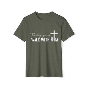 May include: A green t-shirt with the text "Pretty girls walk with him" and a white cross graphic.