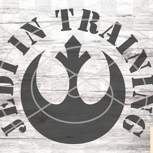 May include: A black and white graphic design of the Rebel Alliance symbol from Star Wars with the text "Jedi in Training" around the symbol.