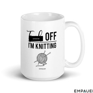 May include: White ceramic mug with a black graphic that says "F--- OFF I'M KNITTING" with a drawing of a ball of yarn and knitting needles. The text "censored" is over the first word.