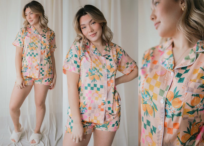 May include: A pink and green patterned pyjama top and shorts set with a checkered pattern and floral and citrus fruit designs.