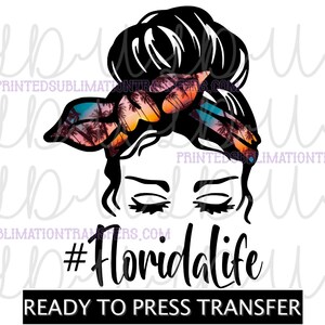 May include: A black and white graphic of a woman's face with her hair in a bun and a tropical sunset bandana. The text "#Floridalife" is below the face, with "READY TO PRESS TRANSFER" in a black rectangle.