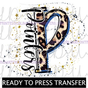May include: A ready-to-press transfer featuring a stylized letter "P" with a leopard print design and a blue outline. The word "Summer" is written vertically in a script font. Gold stars and black ink splatters decorate the background.