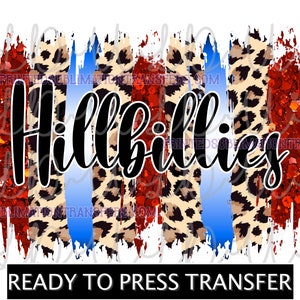 May include: A graphic design featuring the word "Hillbillies" in a bold, cursive font. The design incorporates red glitter, leopard print, and blue brushstrokes. The text "READY TO PRESS TRANSFER" is at the bottom.