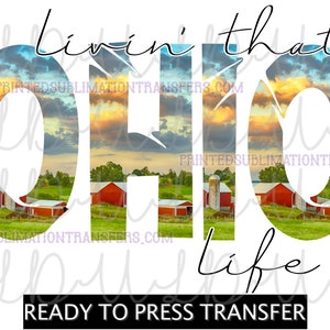 May include: A white graphic with the words "livin' that Ohio life" in a script font. The word "Ohio" is filled with a landscape of red barns and a sunset. The words "Ready to press transfer" are at the bottom.