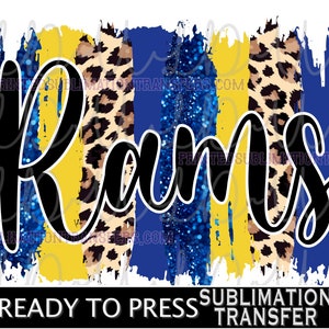 May include: A sublimation transfer design featuring the word "Rams" in a black script font. The background includes vertical brushstrokes in yellow, blue, and leopard print. The text "READY TO PRESS SUBMLIMATION TRANSFER" is at the bottom.