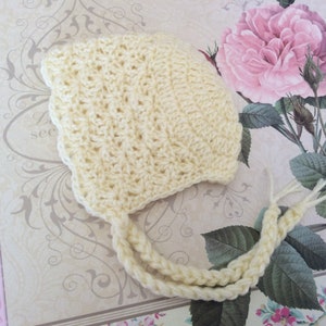 Newborn baby sized crochet vintage style bonnet