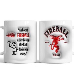 May include: White ceramic coffee mug with a red and black Fireball Whiskey logo on one side and a stick figure holding a bottle with the text "A shot of FIREBALL a day keeps the bad decisions away." on the other side.