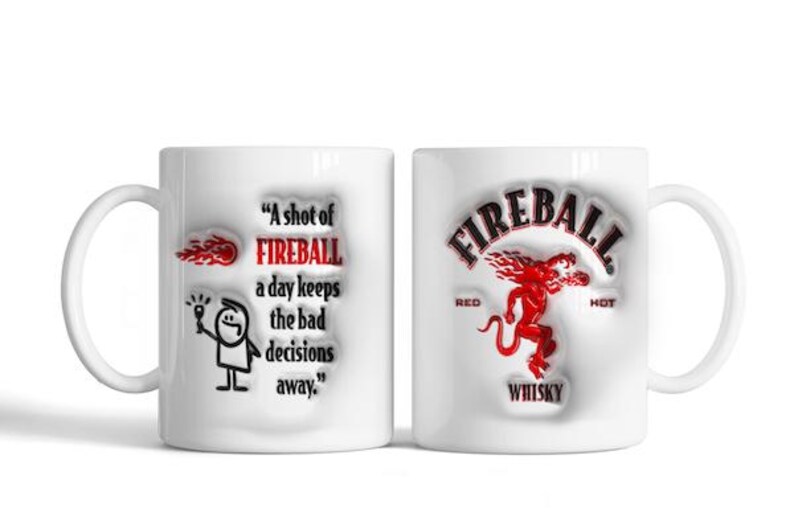 May include: White ceramic coffee mug with a red and black Fireball Whiskey logo on one side and a stick figure holding a bottle with the text "A shot of FIREBALL a day keeps the bad decisions away." on the other side.