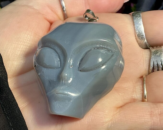 Hand-Carved Chalcedony Alien Skull Pendant: White & Blue Crystal