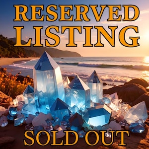 May include: A collection of translucent blue and clear crystals arranged on a sandy beach at sunset. The text RESERVED LISTING is printed in large orange letters at the top, and the text SOLD OUT is printed in orange letters at the bottom.