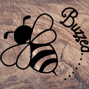 May include: Black and white illustration of a bee with the word "Buzzed" written in a cursive font with a dotted line trailing behind the word.