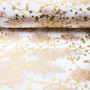 Japanese chiyogami paper featuring scattered metallic gold geometric shapes and fine gold lines on a white background.