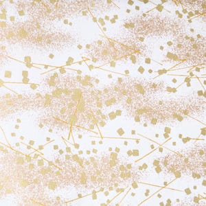 Japanese chiyogami paper featuring scattered metallic gold geometric shapes and fine gold lines on a white background.