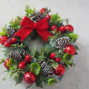 Miniature doll/dollhouse Holly Christmas wreath/ red berries/snowy pine cones/red sparkle ornaments/satin bow