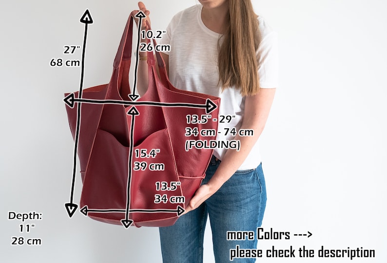 May include: A large, burgundy leather tote bag with a zippered pocket on the front. The bag measures 27 inches tall, 15.4 inches wide, and 13.5 inches deep. The bag can be folded to adjust the width from 34 to 74 cm.