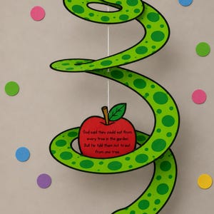 May include: A green and black paper snake with a red apple and text. The apple has a green leaf and the text reads: "God said they could eat from every tree in the garden. But He told them not to eat from one tree."