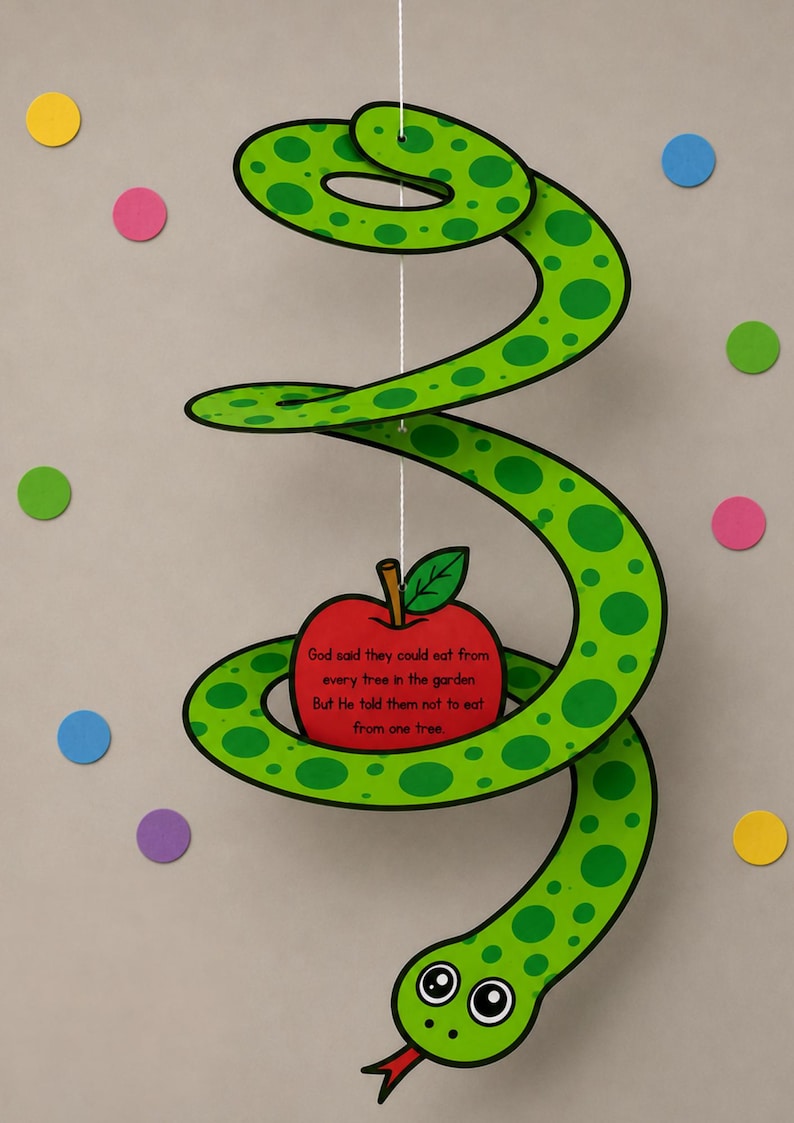 May include: A green and black paper snake with a red apple and text. The apple has a green leaf and the text reads: "God said they could eat from every tree in the garden. But He told them not to eat from one tree."