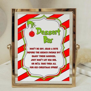 May include: Printable 8x10 inch sign with red and white stripes and green accents. The sign says "Dessert Bar" and features a Grinch-themed design with the text "Don't be shy, grab a bite before the Grinch swings by! Enjoy these goodies, just don't let him see, or he'll take them all for his Christmas spree!"