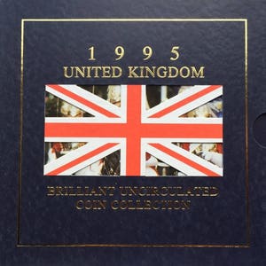 May include: A blue coin collection folder with a gold border. The folder has a red, white and blue Union Jack flag on the front. The text "1995 UNITED KINGDOM" is above the flag, and the text "BRILLIANT UNCIRCULATED COIN COLLECTION" is below the flag.