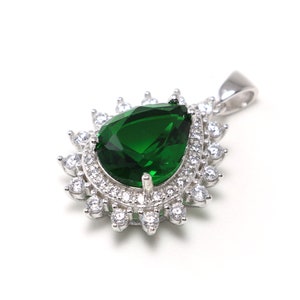 Handmade sterling silver necklace with vivid green spinel centerpiece, surrounded by crystals