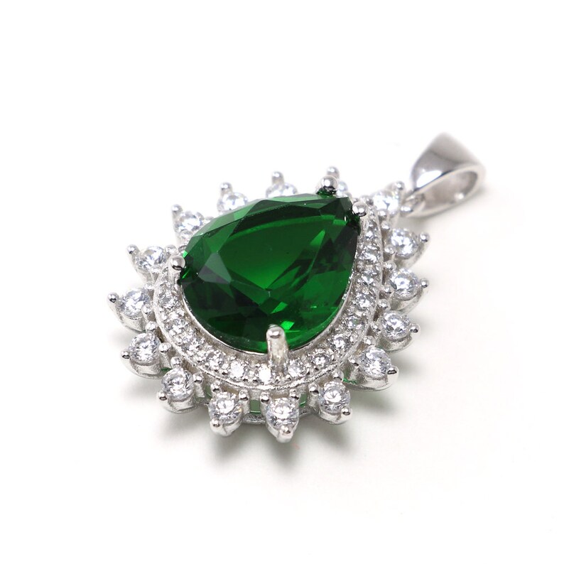 Handmade sterling silver necklace with vivid green spinel centerpiece, surrounded by crystals