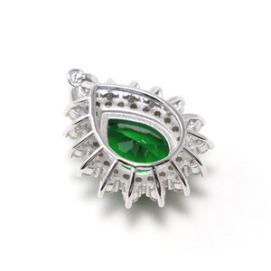 Oval green spinel necklace with silver chain and cubic zirconia halo, classic and timeless jewelry