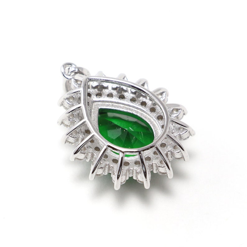 Oval green spinel necklace with silver chain and cubic zirconia halo, classic and timeless jewelry