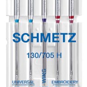 May include: A pack of four Schmetz sewing machine needles, labeled 130/705 H. The needles are in a white plastic case with blue, purple, and red accents. The needles are labeled as Universal, Wing, and Embroidery, with corresponding sizes: 90/14, 90/14, 100/16, 75/11, and 75/11.
