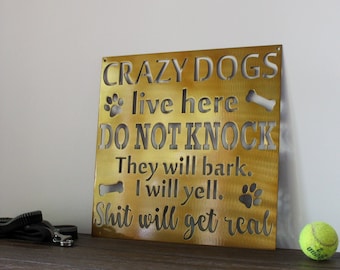Crazy Dogs Live Here Metal Sign: Paw Print Decor