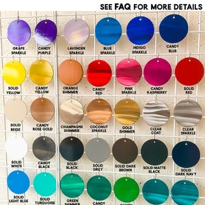 May include: A grid display of circular metal samples featuring various powder coat colors and finishes. Text labels identify each color, including Grape Sparkle, Candy Purple, Lavender Sparkle, Blue Sparkle, Indigo Sparkle, Candy Blue, and others.