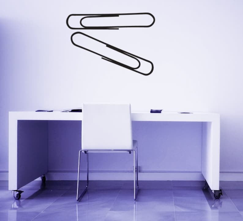 Office stationery wall decal with large paper clip silhouette, minimalist modern decor for desk area, classroom inspiration, and meaningful remembrance aesthetic.