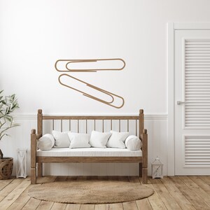 Modern workspace wall decal showcasing bold paper clip outline, simple line art decor for office, classroom display, and meaningful history inspired design.