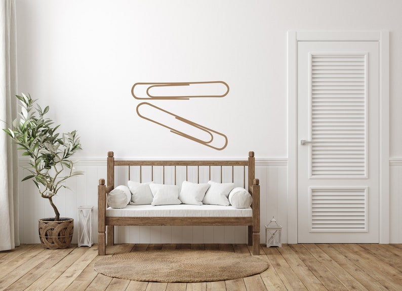 Modern workspace wall decal showcasing bold paper clip outline, simple line art decor for office, classroom display, and meaningful history inspired design.
