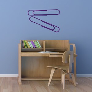 Minimalist paper clip decal inspired by office stationery art, contemporary wall decor for teacher classroom, study area, and subtle Operation Paperclip conversation piece.