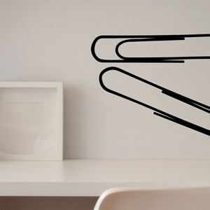 Minimalist office decal featuring paper clip graphic, modern line design decor for workspace, school office, and thoughtful Paperclip Project reference.
