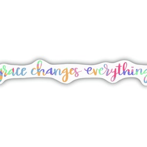 May include: A colorful sticker with the text "grace changes everything" in a handwritten font.