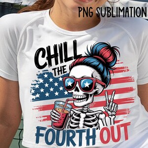 May include: White t-shirt with a graphic featuring a skeleton wearing sunglasses and a bun, holding a drink with a straw. The design includes the text "CHILL THE FOURTH OUT" with an American flag background.
