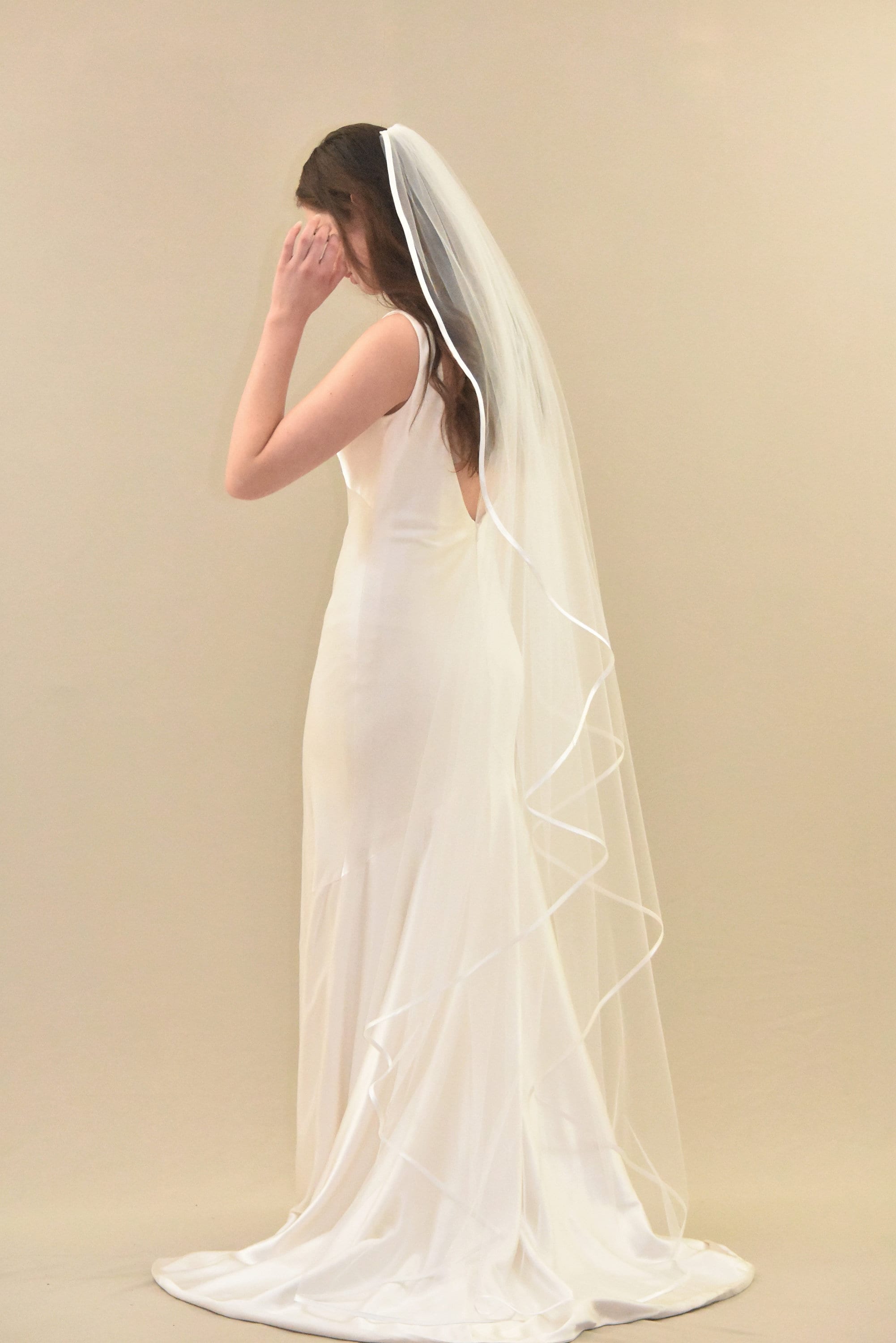 Style TG1015L060: Waltz Length Angel Cut Veil with Sequined Lace Appliqués