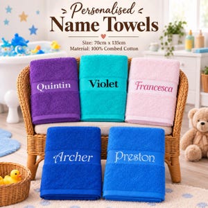 May include: Five rectangular bath towels in purple, turquoise, light pink, and two shades of blue, each featuring a personalised name embroidered on a band. The towels measure 70cm x 135cm and are made of 100% combed cotton. Text reads: Personalised Name Towels.